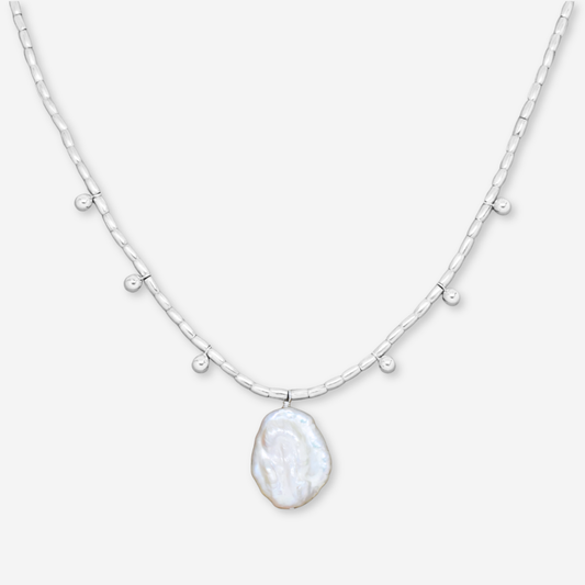 Necklace with a large, irregularly shaped pendant on a white background