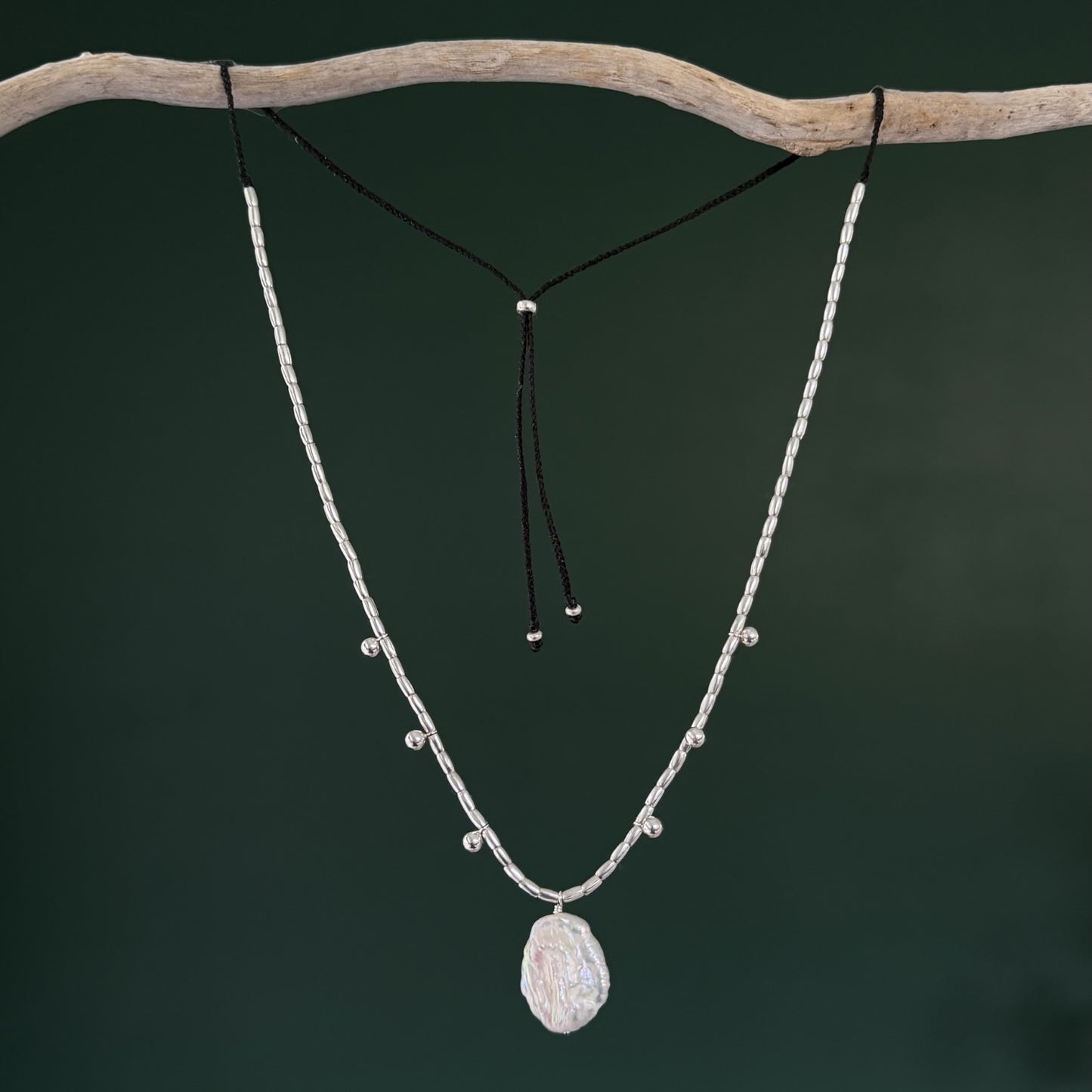Necklace with a pendant on a dark background