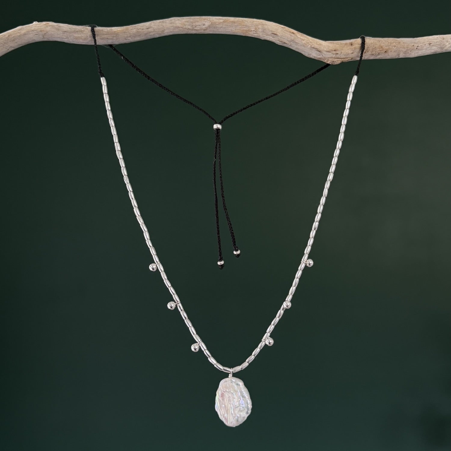 Necklace with a pendant on a dark background