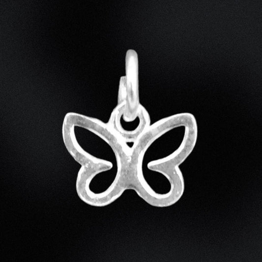 Silver butterfly pendant on a black background
