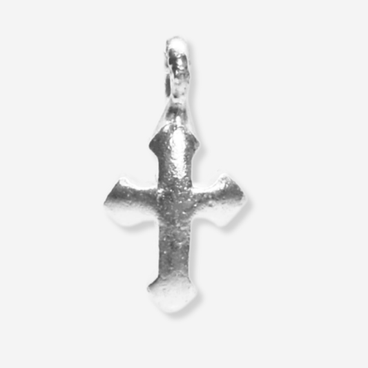 Silver cross pendant on a white background