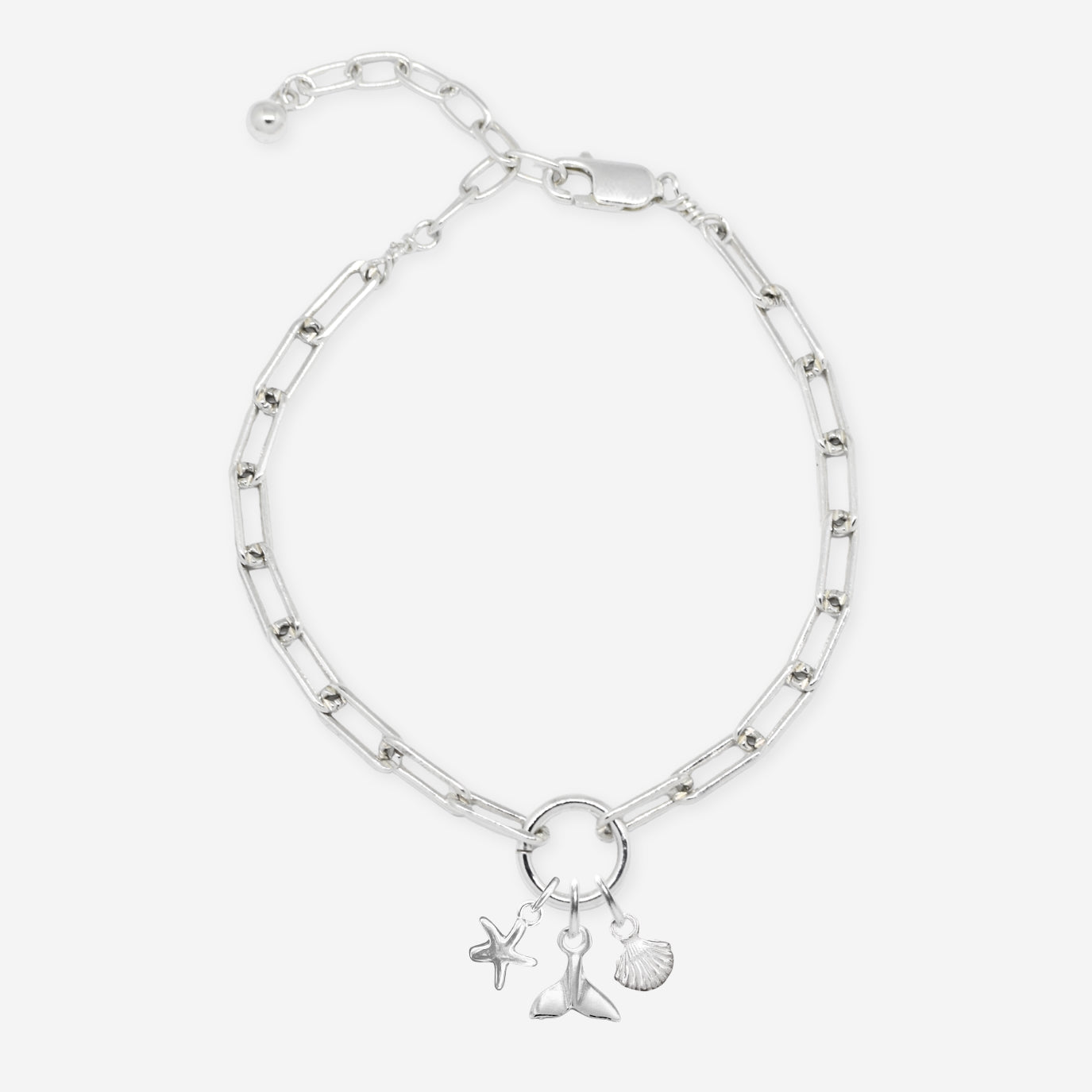 Silver bracelet with charms on a white background