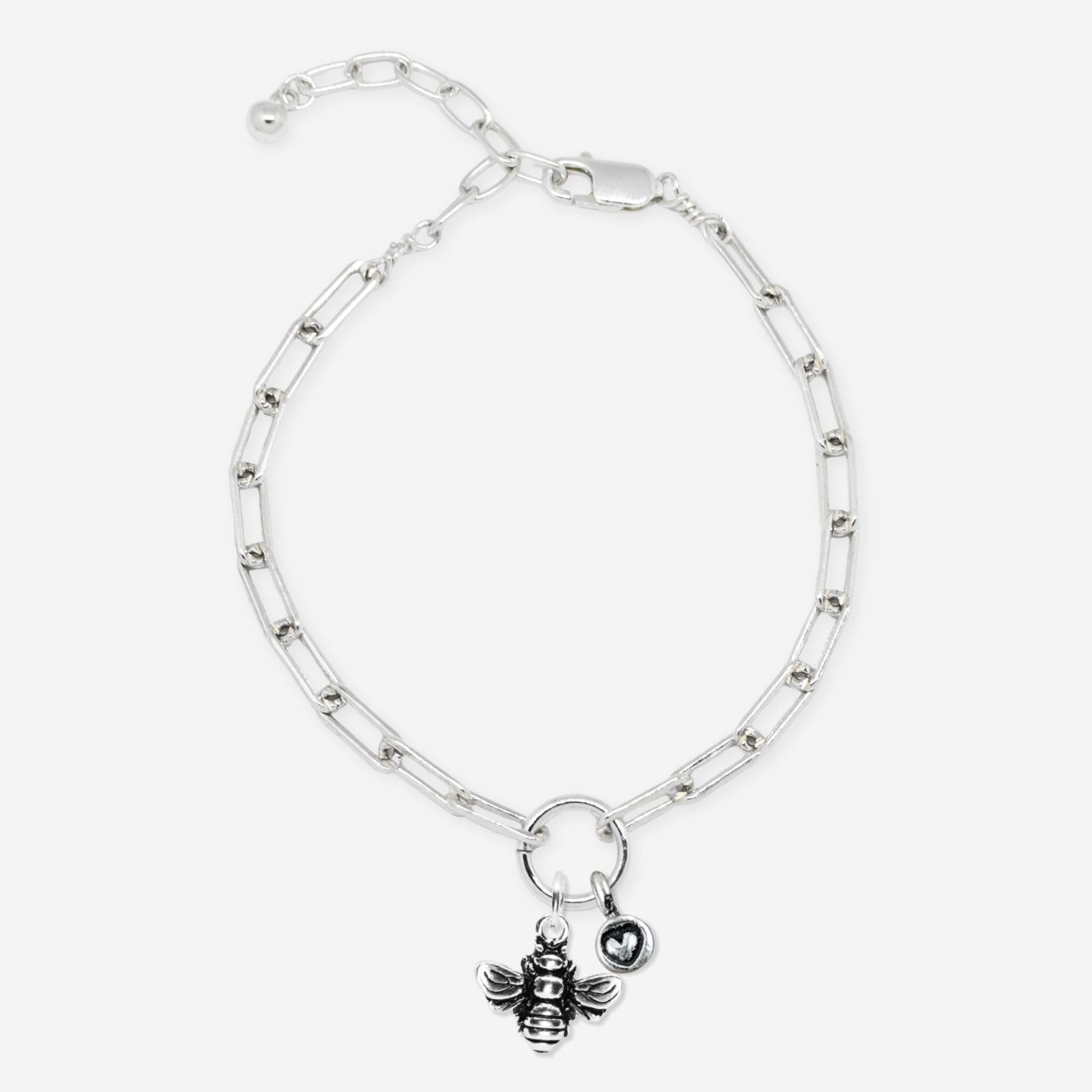 Silver bracelet with a bee charm on a white background