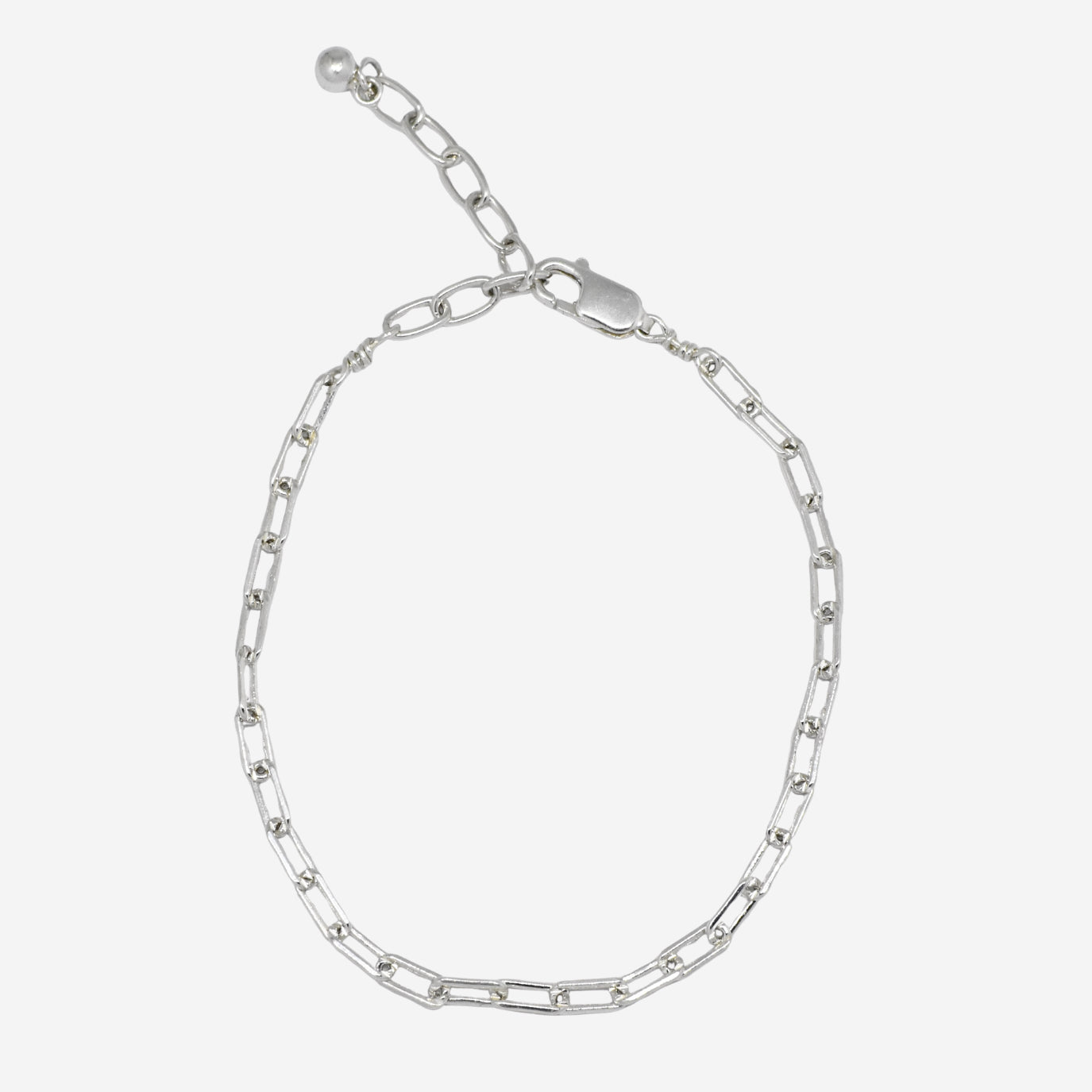 Silver chain bracelet on a light gray background