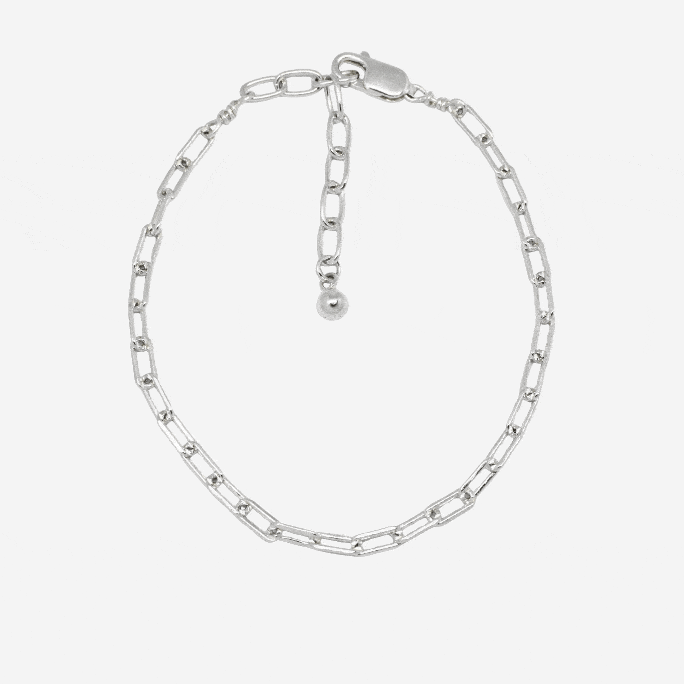 silver chain bracelet with charms on white background