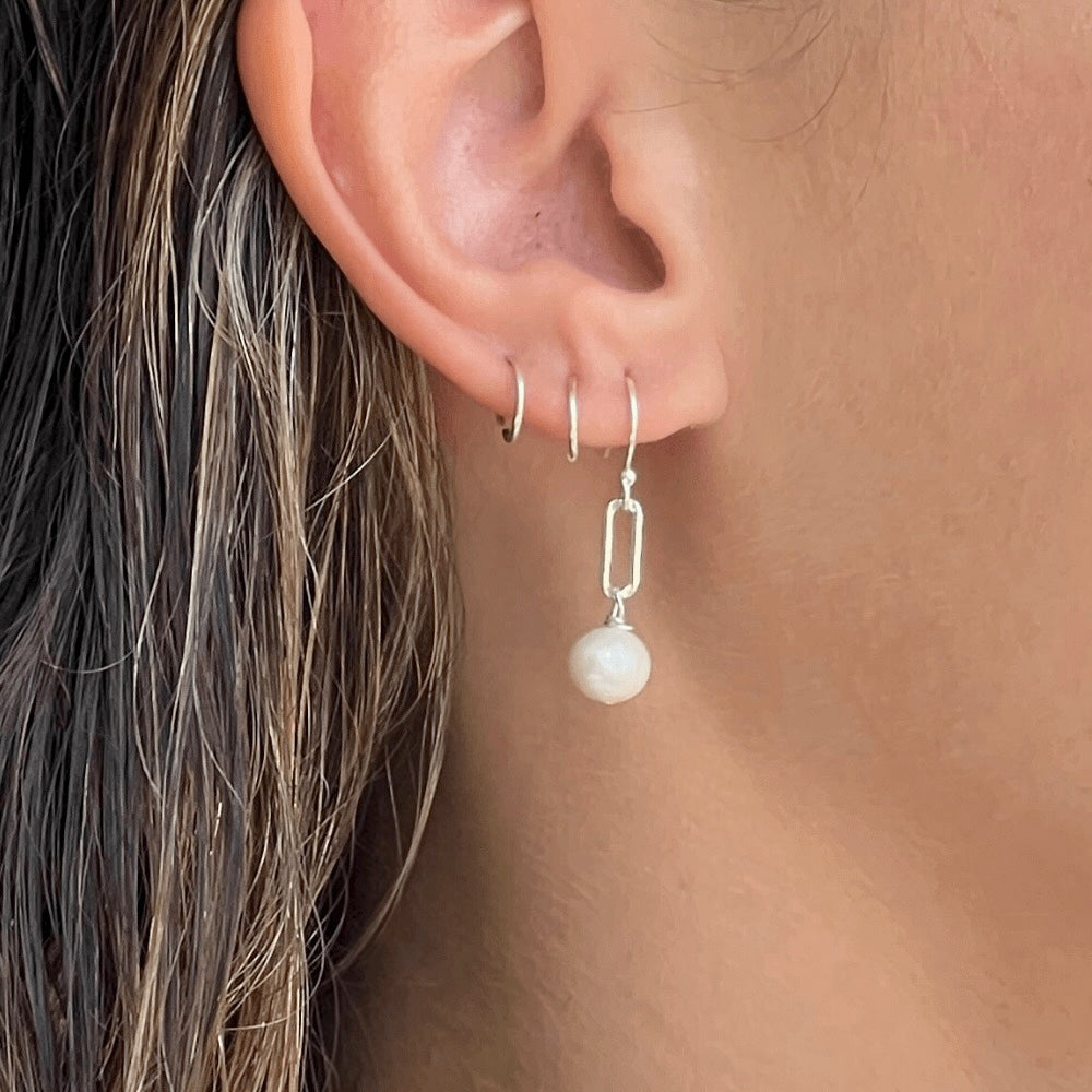 Stand out with these stylish and unique Paperclip Link & Freshwater Pearl Earrings. Handcrafted in Australia with 925 sterling silver, these earrings offer a subtle yet sophisticated look to complete any outfit. Dare to be different and add these to your collection today!