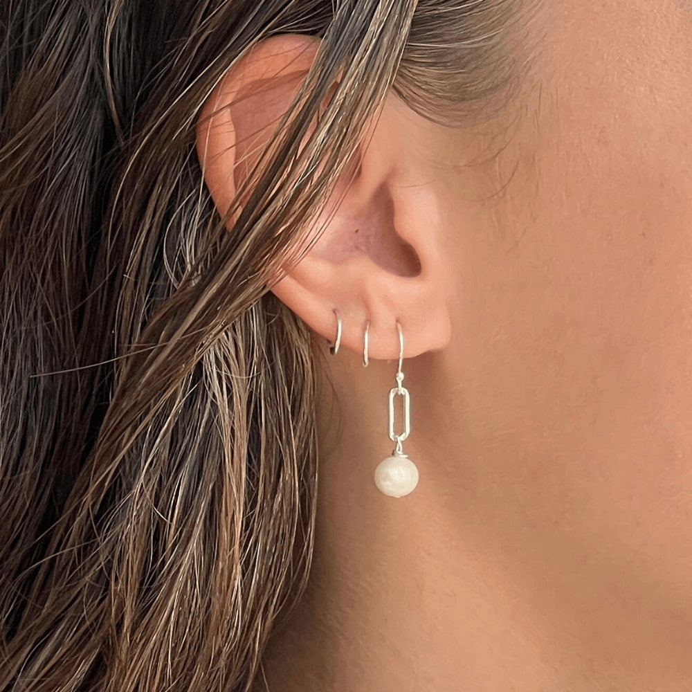 Stand out with these stylish and unique Paperclip Link & Freshwater Pearl Earrings. Handcrafted in Australia with 925 sterling silver, these earrings offer a subtle yet sophisticated look to complete any outfit. Dare to be different and add these to your collection today!