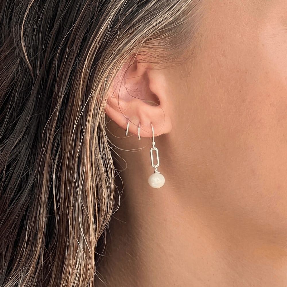 Stand out with these stylish and unique Paperclip Link & Freshwater Pearl Earrings. Handcrafted in Australia with 925 sterling silver, these earrings offer a subtle yet sophisticated look to complete any outfit. Dare to be different and add these to your collection today!