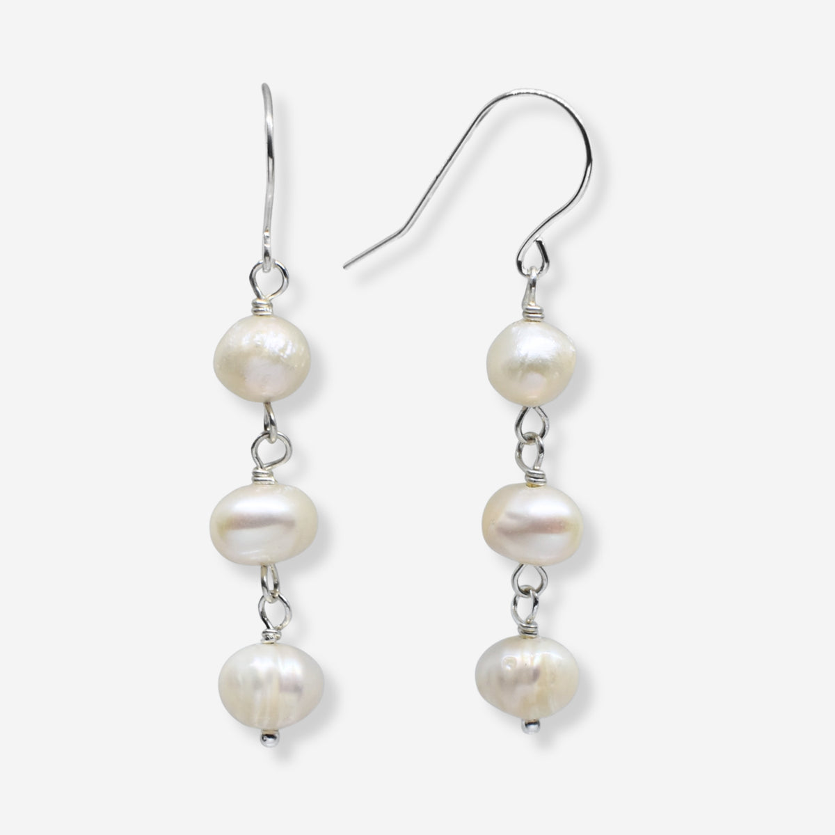 Pair of pearl earrings on a white background