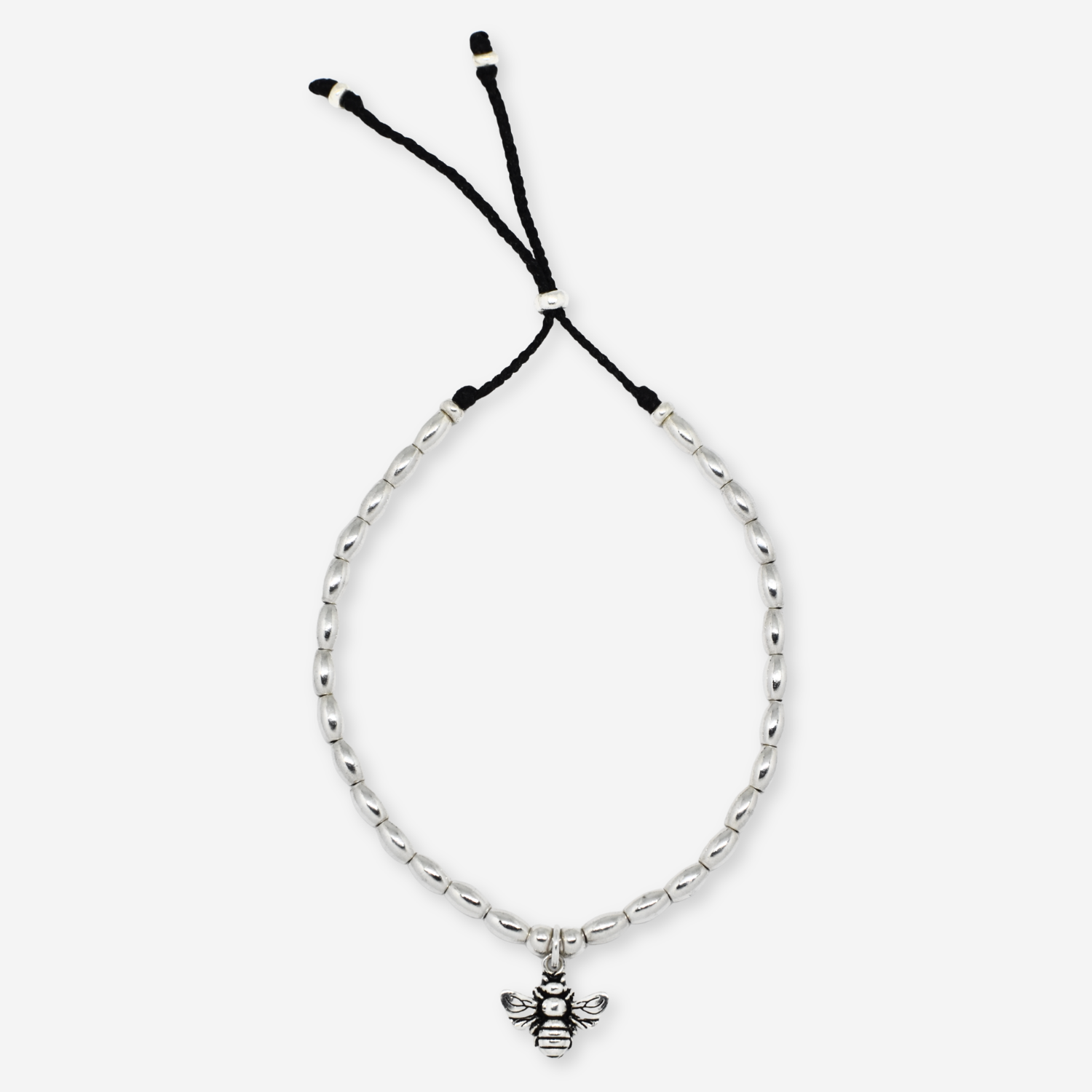 Silver bracelet with a bee charm on a white background