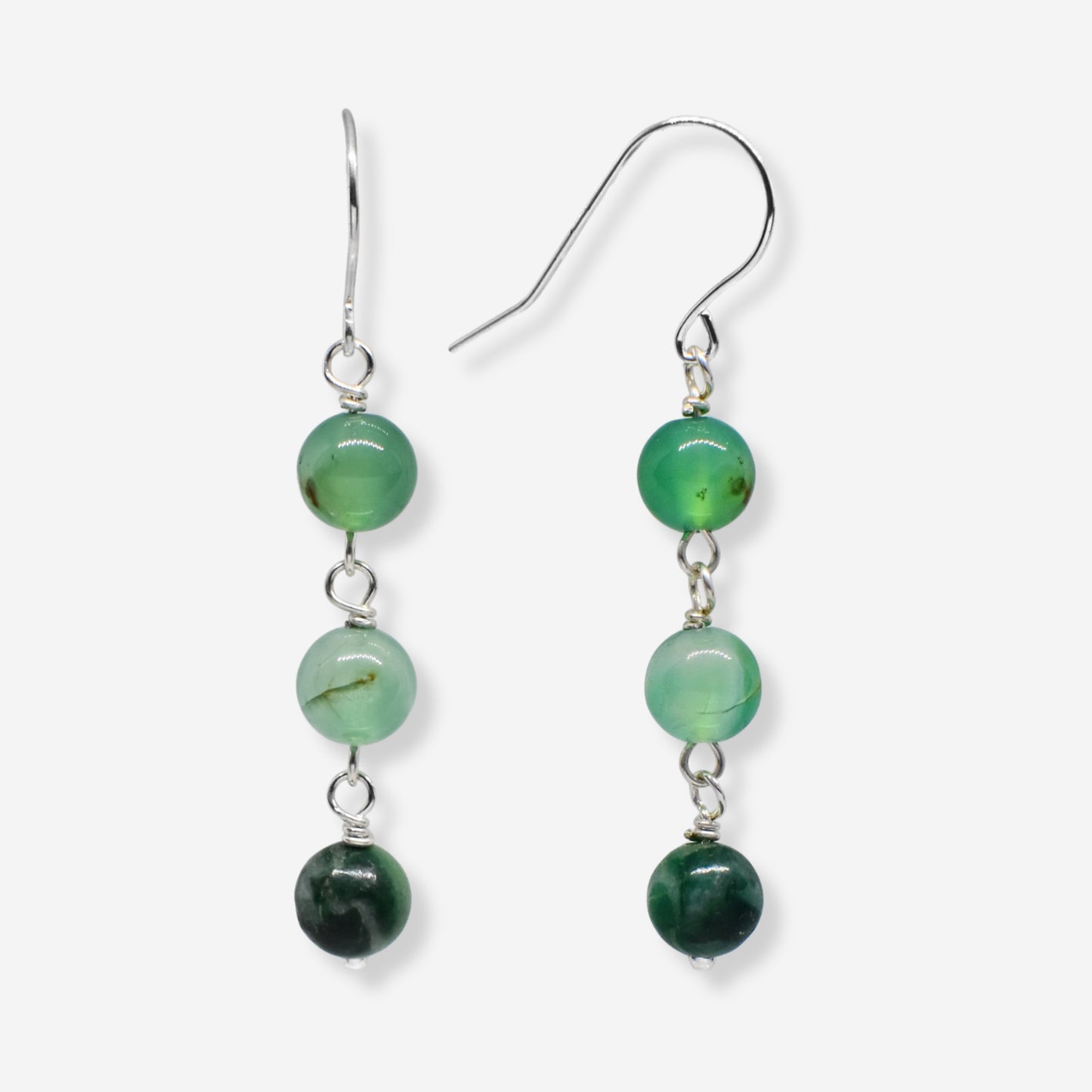 Green beaded earrings on a white background