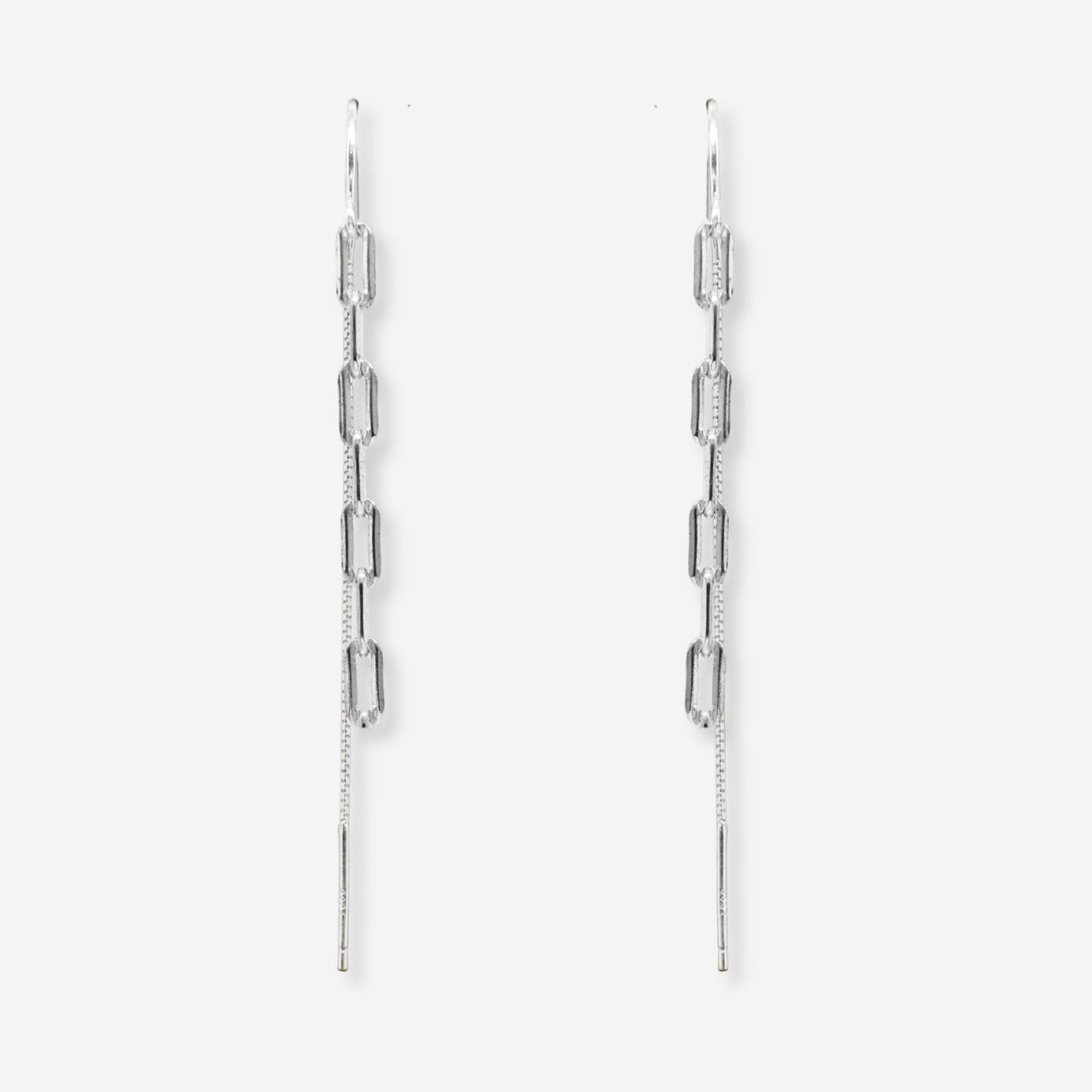 Pair of silver chain earrings on a light gray background
