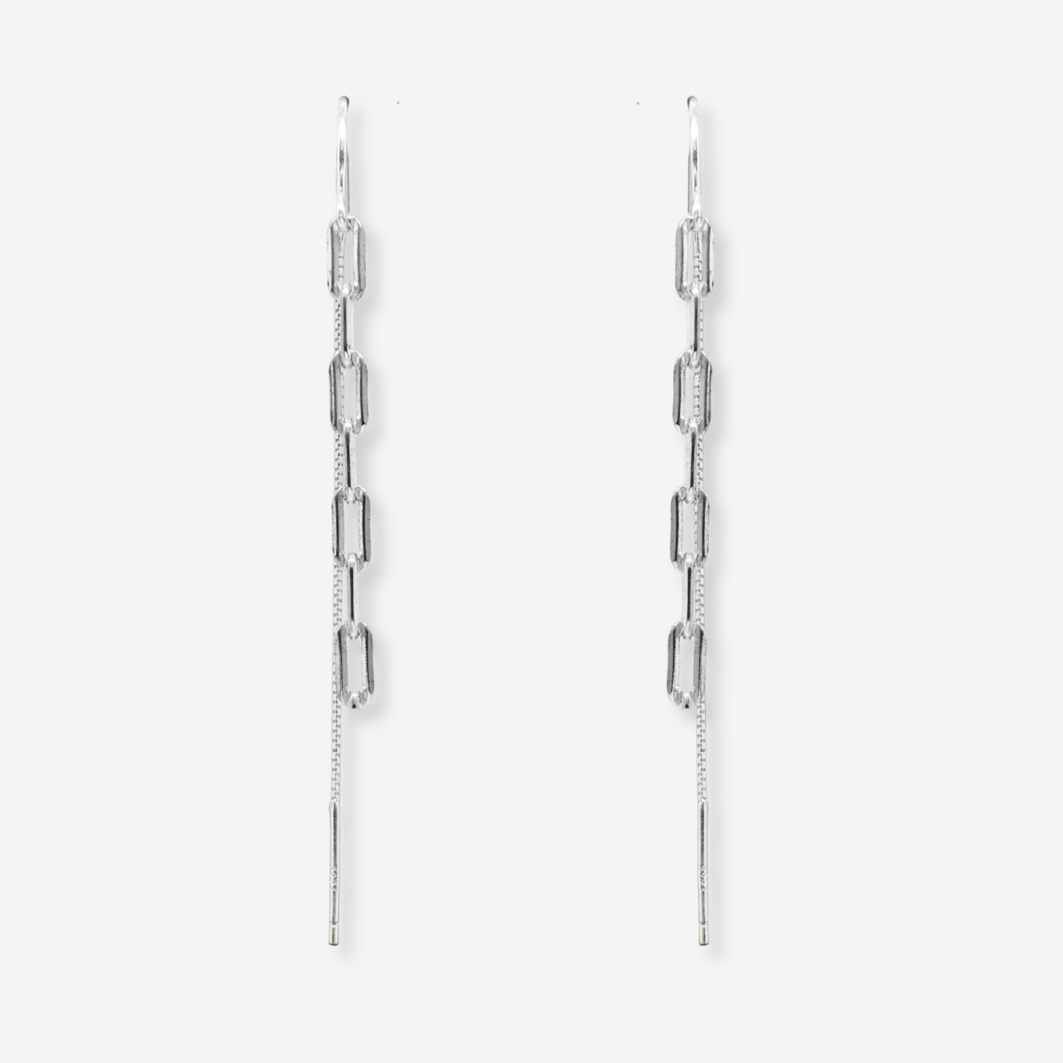 Pair of silver chain earrings on a light gray background